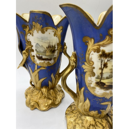 620 - Pair of Daniel blue and gold gilded vases, 17.5cm tall,some mottling to paint finish.A/F.