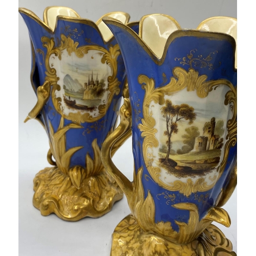 620 - Pair of Daniel blue and gold gilded vases, 17.5cm tall,some mottling to paint finish.A/F.