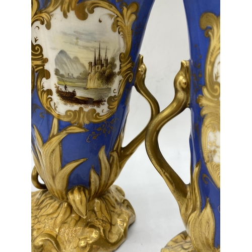 620 - Pair of Daniel blue and gold gilded vases, 17.5cm tall,some mottling to paint finish.A/F.