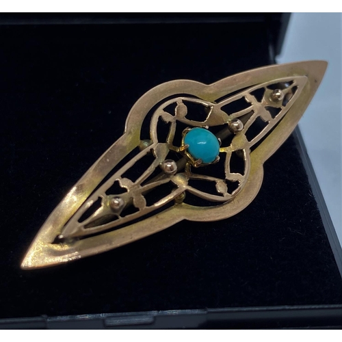 637 - 9ct gold bar brooch having centre turquoise stone surrounded by gold piercing and four gold beads, 4... 