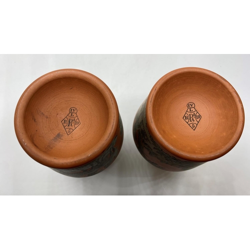 663 - Pair of Terracota pots, 11cm tall with hunting, fishing and shooting decoration (2)