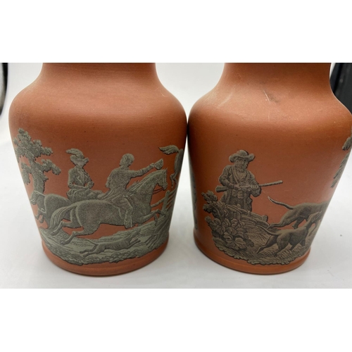 663 - Pair of Terracota pots, 11cm tall with hunting, fishing and shooting decoration (2)