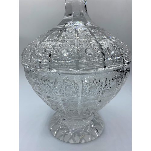 179 - A crystal bowl with lid, 23cms tall and weighs 1.75 kilos