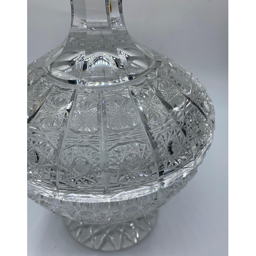 179 - A crystal bowl with lid, 23cms tall and weighs 1.75 kilos