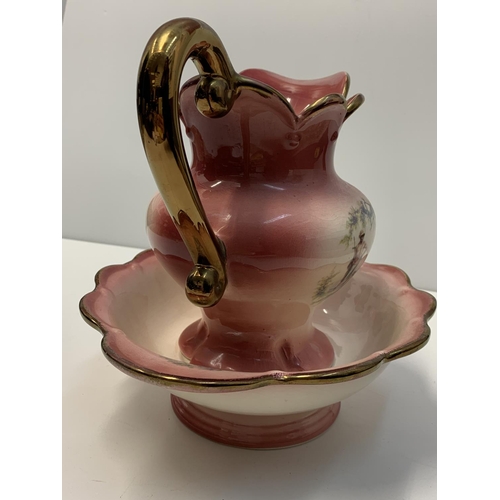 191 - A Staffordshire water jug and matching washing bowl, nicely decorated pink/coral colour.