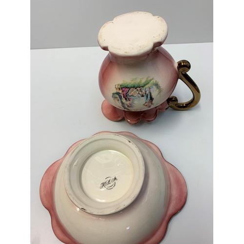 191 - A Staffordshire water jug and matching washing bowl, nicely decorated pink/coral colour.