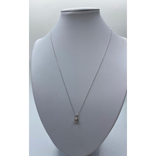 196 - Diamond Pendant in 18ct Gold on a 9ct Gold Chain, 1.3g, 44cms.