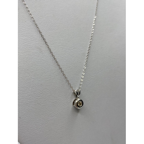 196 - Diamond Pendant in 18ct Gold on a 9ct Gold Chain, 1.3g, 44cms.