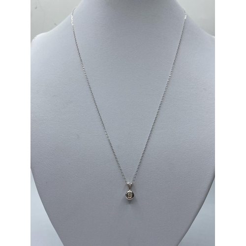 196 - Diamond Pendant in 18ct Gold on a 9ct Gold Chain, 1.3g, 44cms.