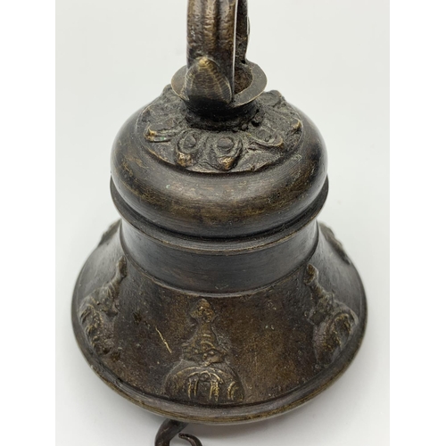 259 - Vintage bronze bell, 9cms tall.