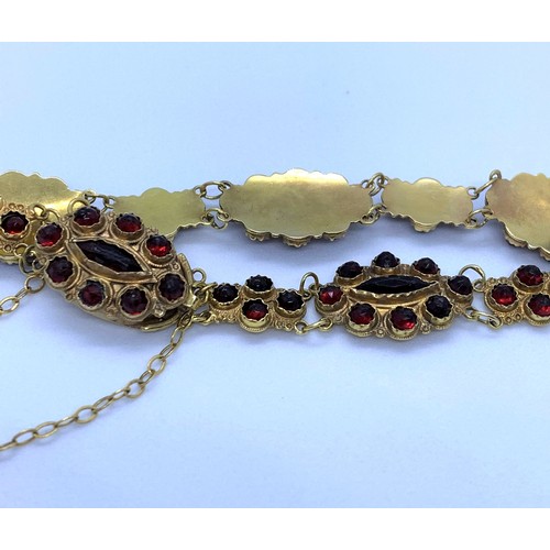 339 - 18K Gold Bracelet with Garnet Stones (1 missing), weight 9g and 18cm long approx