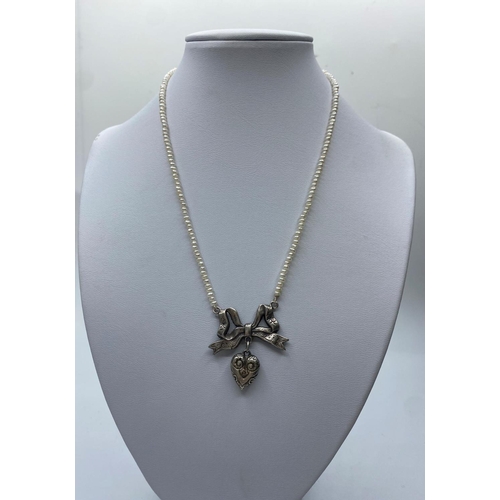 364 - Freshwater Pearl Necklace with Silver Bow and Heart Pendant, 14.2g, 38cms.