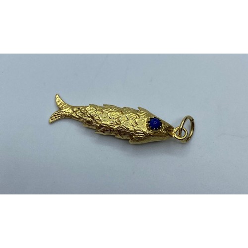 551 - 18ct gold articulated Fish Pendant, weight 6.8g and 4cm long approx.