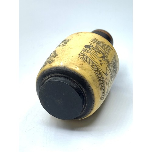 97 - A Chinese bone and ebonised wood snuff bottle with three erotic engravings