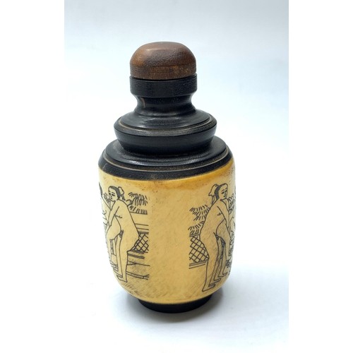 97 - A Chinese bone and ebonised wood snuff bottle with three erotic engravings