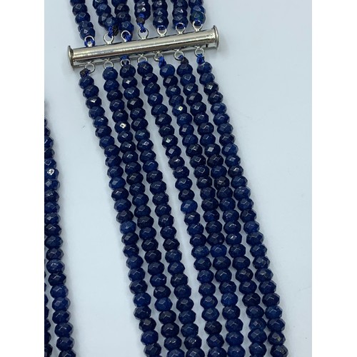 103 - A seven row of faceted. 3-4mm dark blue sapphire beads necklace. Length 44-59cm. Weight 92g