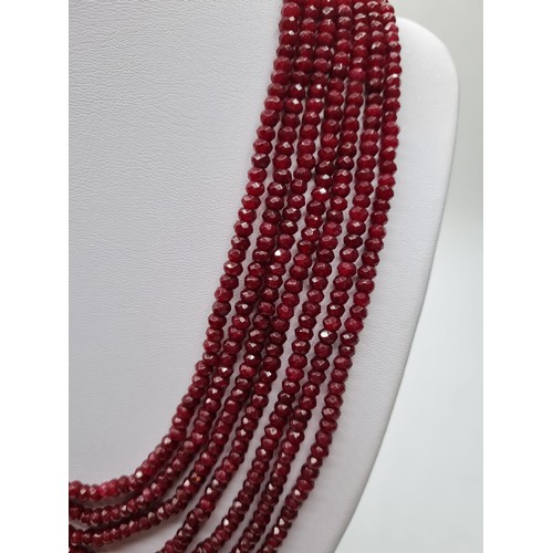 87 - A seven row of faceted . 3-4mm ruby beads necklace. Length 44-58cm. Weight 94g