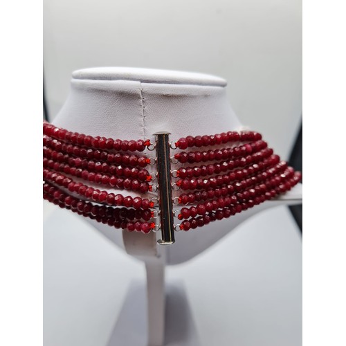 87 - A seven row of faceted . 3-4mm ruby beads necklace. Length 44-58cm. Weight 94g