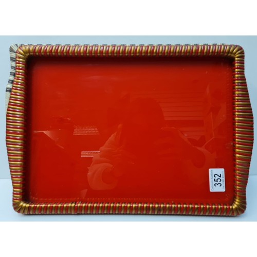 352 - 2x vintage trays 1950s.
tray 1 - red with woven sides
tray 2 - having a vernon ward glazed print bas... 