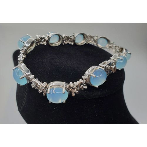 119 - Stone Set Silver Bracelet Having 9 Pale Blue Cabochon Moonstones Spaced with Filigree Linkwork, 19.5... 