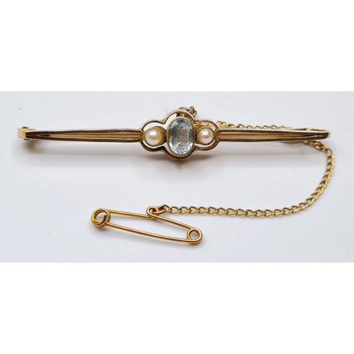 165 - Antique 15ct Gold Bar Brooch, Having a Topaz to centre bordered with Seed Pearls .Safety Chain Attac... 