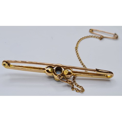 165 - Antique 15ct Gold Bar Brooch, Having a Topaz to centre bordered with Seed Pearls .Safety Chain Attac... 