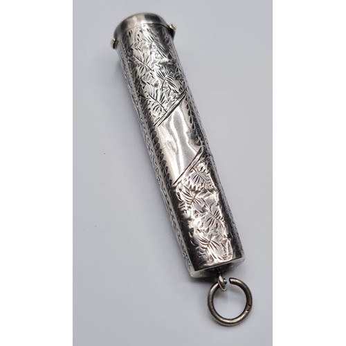 241 - antique silver needle case. having floral engraving and blank cartouche. hinged lid in perfect order... 