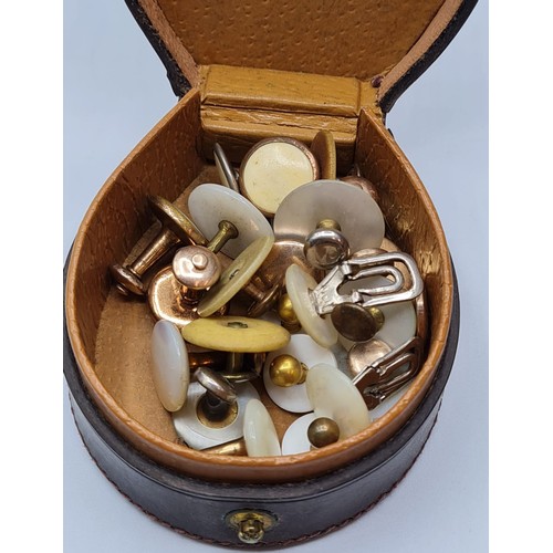 279 - Gentleman's Leather Shirt Stud Box. Horseshoe shaped and having a large selection of mother of peal ... 