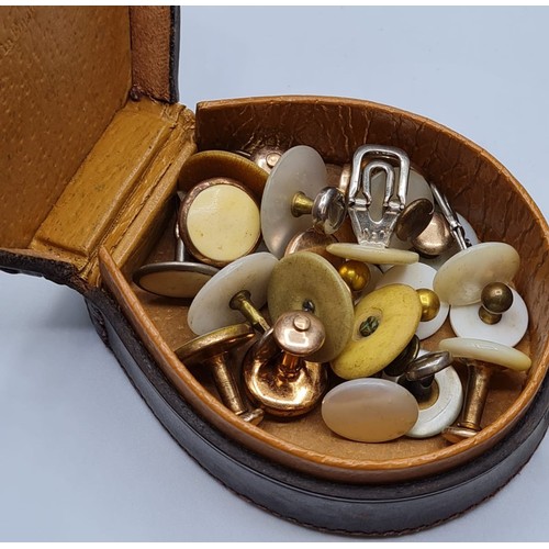 279 - Gentleman's Leather Shirt Stud Box. Horseshoe shaped and having a large selection of mother of peal ... 