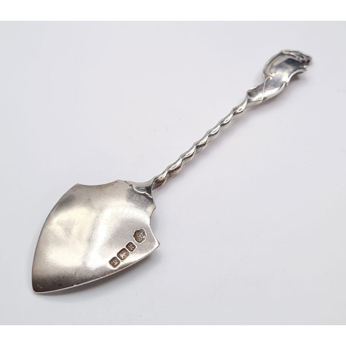 289 - Antique silver spoon in the form of a spade. Having a barley twist handle and scroll work to finial.... 