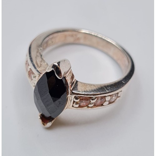 330 - Silver Ring with Boat Shaped Dark Faceted Stone to Mount. Clear Stones on Both Shoulders, Size M