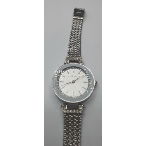 333 - Anne Klein ladies wristwatch. White metal mesh strap with Zirconias. Perfect working order.