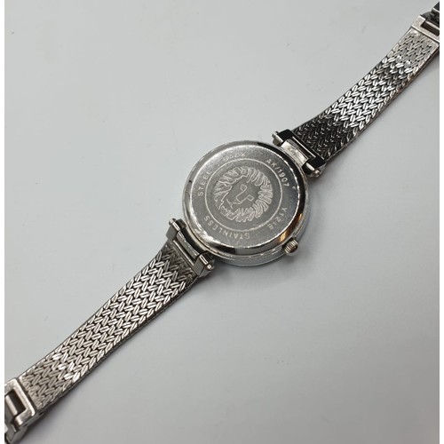 333 - Anne Klein ladies wristwatch. White metal mesh strap with Zirconias. Perfect working order.