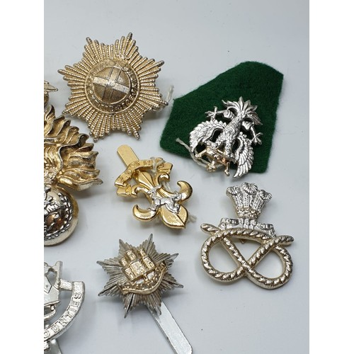 127 - 10 x Staybright Cap Badges.