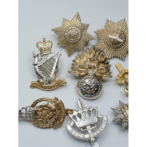 127 - 10 x Staybright Cap Badges.