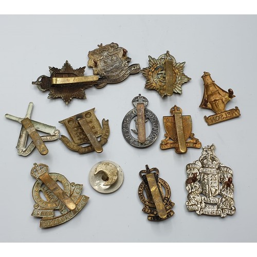 136 - 12 x British Army Cap Badges.