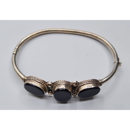 307 - Stone Set Silver Bangle Having Three Black Onyx Oval Gemstones. Clasp Opening to Side Marked 925.