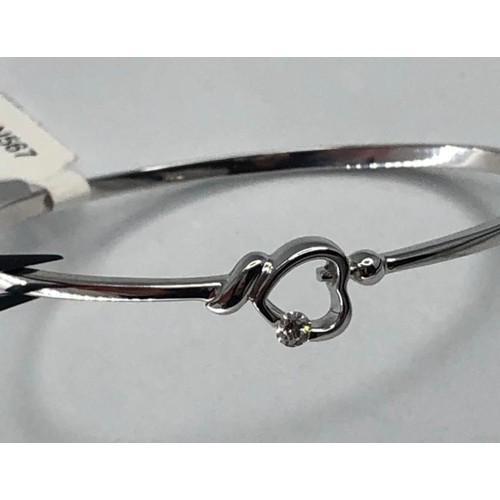 410 - 9k White Gold Heart shaped bangle with 0.15ct Diamond, weight 10.3g (ECN567)