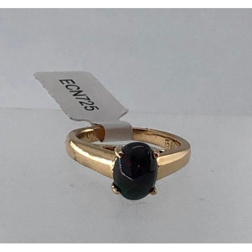 437 - 18k yellow gold ring with 1.40ct black opal in cabochon shape, weight 5.6g and size K (ECN725)