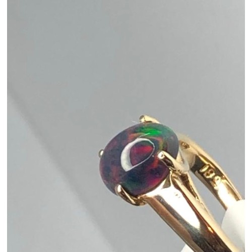 437 - 18k yellow gold ring with 1.40ct black opal in cabochon shape, weight 5.6g and size K (ECN725)