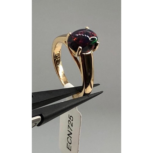 437 - 18k yellow gold ring with 1.40ct black opal in cabochon shape, weight 5.6g and size K (ECN725)