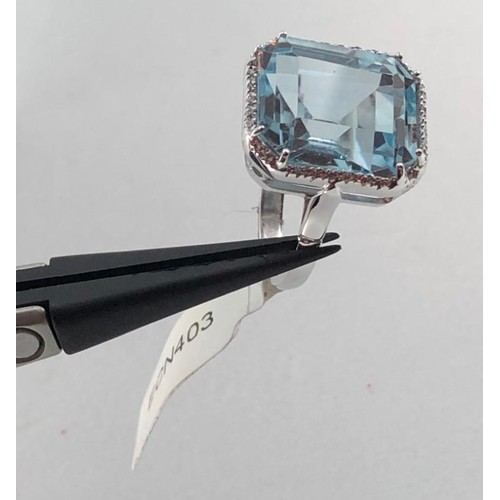 442 - 18k white gold (tested) ring with 12x14mm topaz centre and 0.15ct diamond surrounding, weight 6.3g a... 