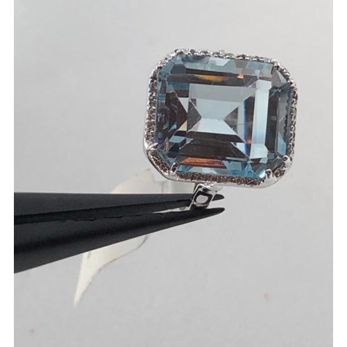 442 - 18k white gold (tested) ring with 12x14mm topaz centre and 0.15ct diamond surrounding, weight 6.3g a... 