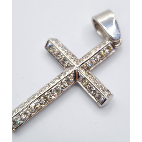 486 - 9CT WHITE GOLD DIAMOND SET CROSS, WEIGHT 16.1G. length 5.5cms