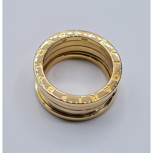 497 - 18CT YELLOW GOLD BVLGARI ZERO SPRING RING, WEIGHT 11.2G. SIZE N