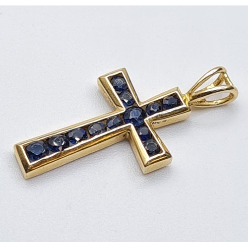 360 - 9ct yellow gold sapphire set cross, weight 1.9g. Length 2.5cms.