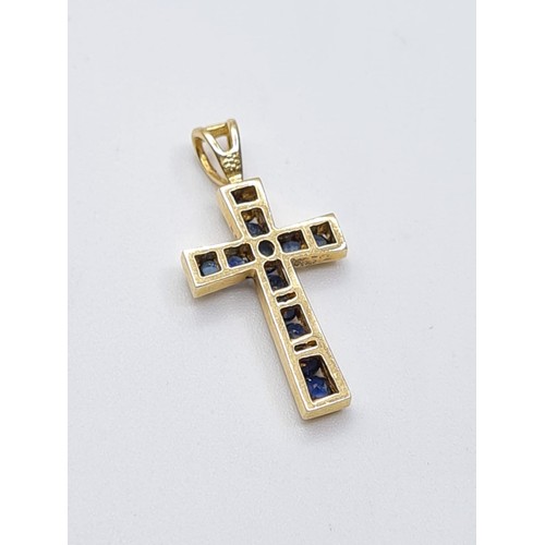 360 - 9ct yellow gold sapphire set cross, weight 1.9g. Length 2.5cms.