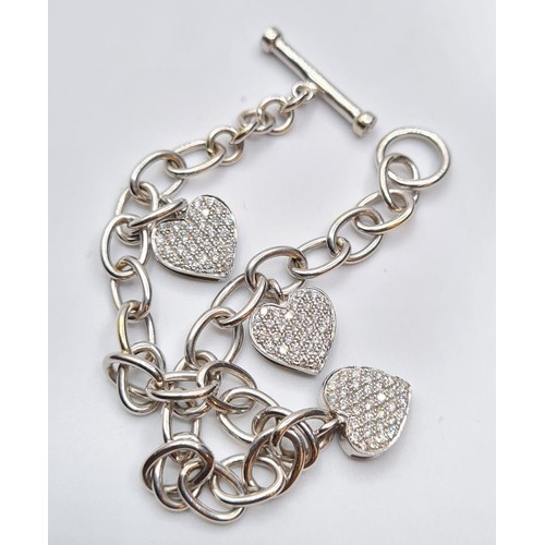 245 - 18CT WHITE GOLD DIAMOND SET HEART CHARM STYLE BRACELET, WEIGHT 18G & 1CT APPROX