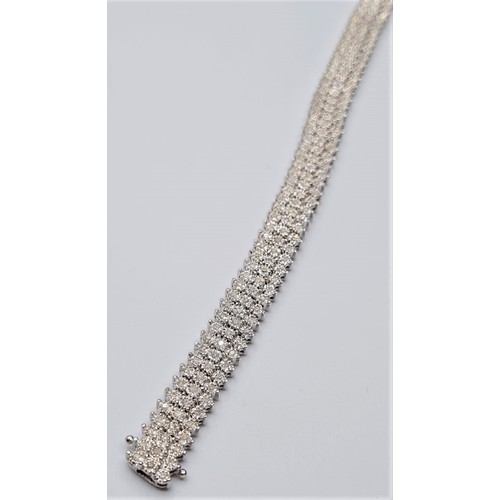 320 - 9ct white gold diamond set 3 row bracelet, weight 19g approx 1.25ct. Size 18cms