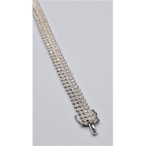 320 - 9ct white gold diamond set 3 row bracelet, weight 19g approx 1.25ct. Size 18cms